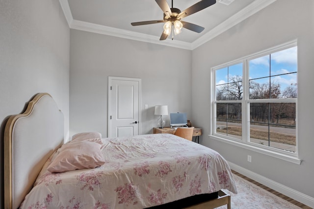 bedroom featuring hardwood / wood-style flooring, ceiling fan, and ornamental molding