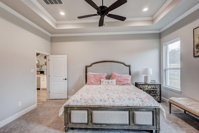 bedroom with light carpet, multiple windows, a raised ceiling, and ceiling fan