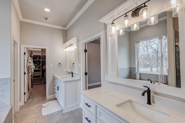 bathroom with tile patterned flooring, vanity, and ornamental molding