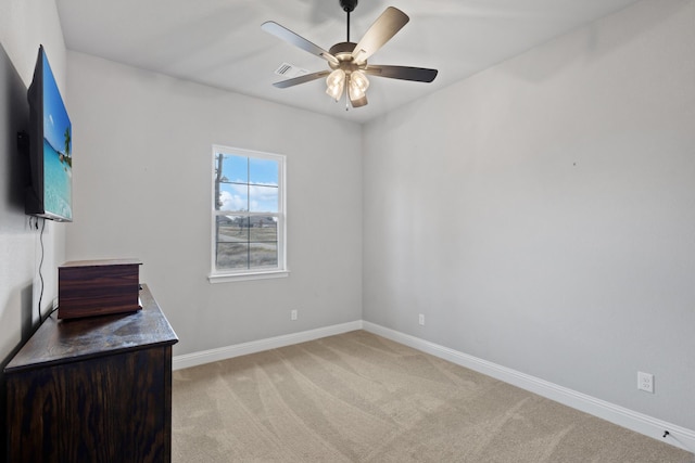 carpeted empty room with ceiling fan