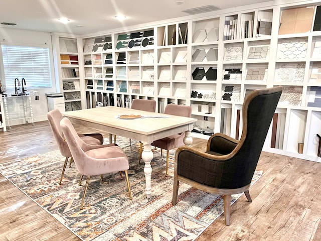 dining space featuring hardwood / wood-style flooring