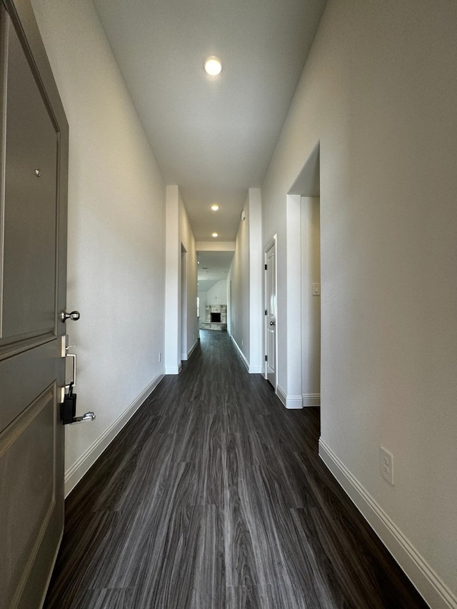 hallway featuring dark hardwood / wood-style flooring