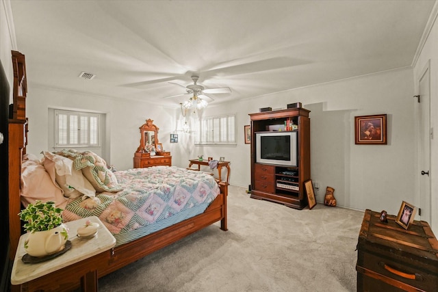 bedroom with ceiling fan, light colored carpet, and crown molding