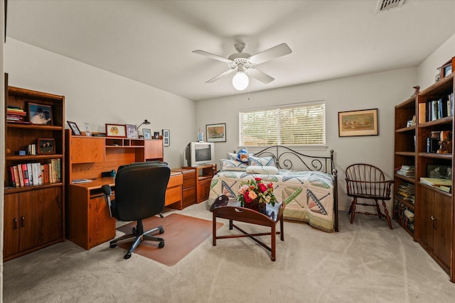 bedroom with ceiling fan and light carpet