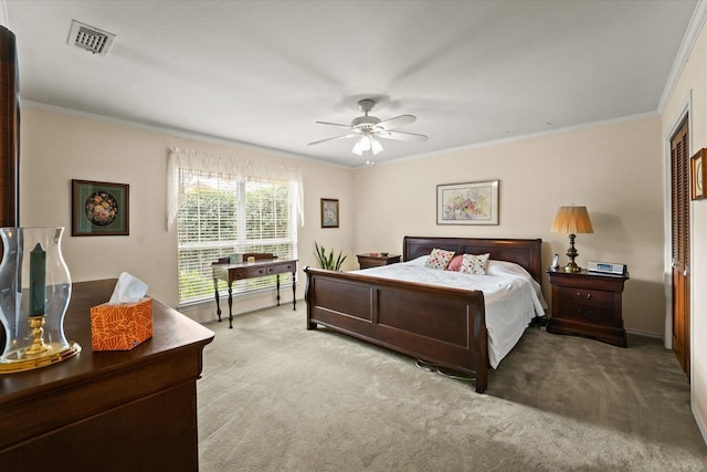 bedroom with light colored carpet, ceiling fan, and crown molding