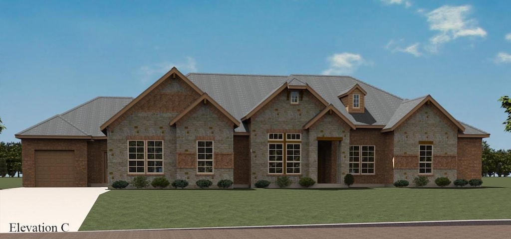 view of front facade with a front yard and a garage