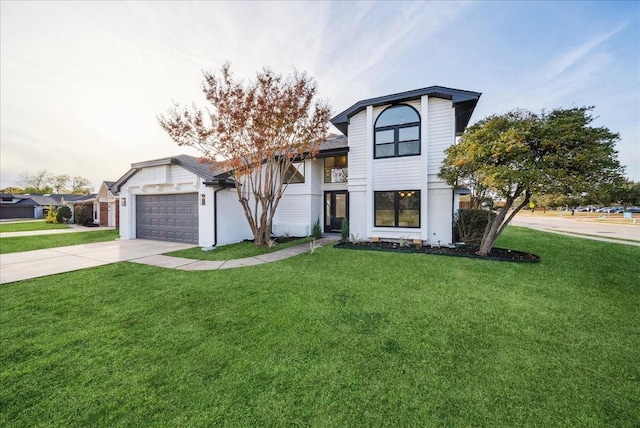 view of front of home featuring a garage and a front yard