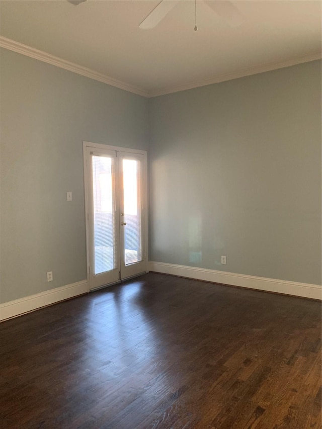 spare room with ceiling fan, french doors, dark hardwood / wood-style floors, and ornamental molding