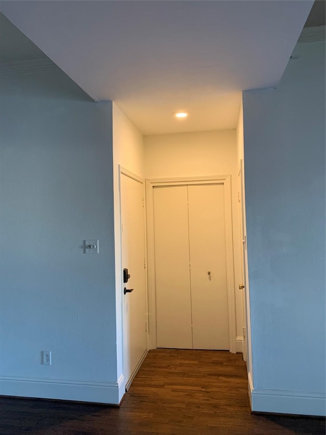 hall with dark wood-type flooring