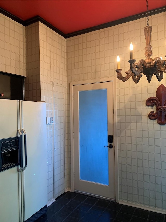 bathroom featuring crown molding and tile walls