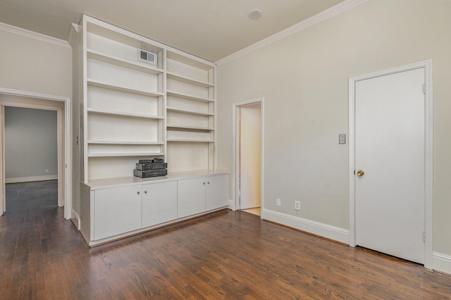 unfurnished living room with built in features, dark hardwood / wood-style flooring, and crown molding