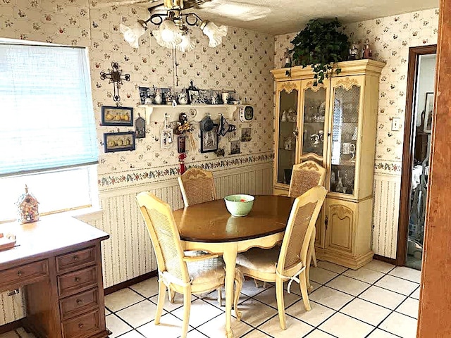 dining area with ceiling fan and light tile patterned floors