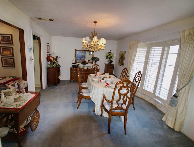 carpeted dining space with a notable chandelier