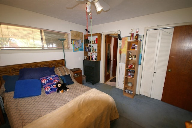 bedroom with ceiling fan, a closet, and carpet