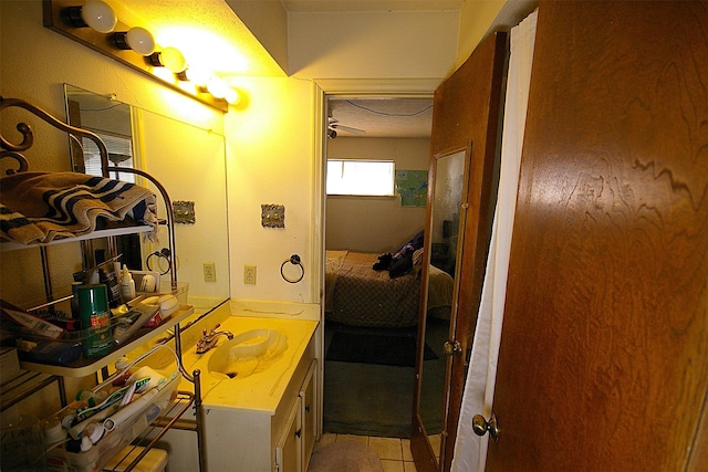 bathroom featuring tile patterned flooring and vanity