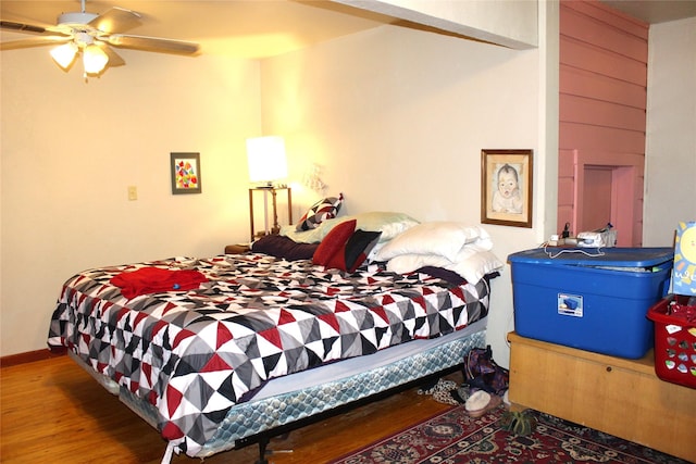 bedroom with hardwood / wood-style floors and ceiling fan