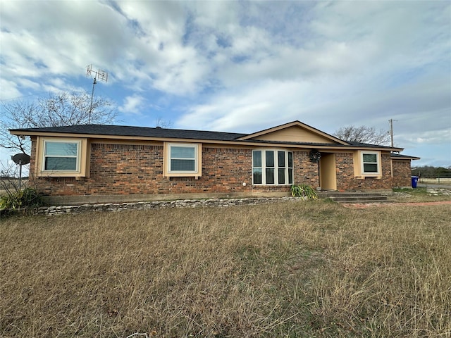 ranch-style house with a front lawn