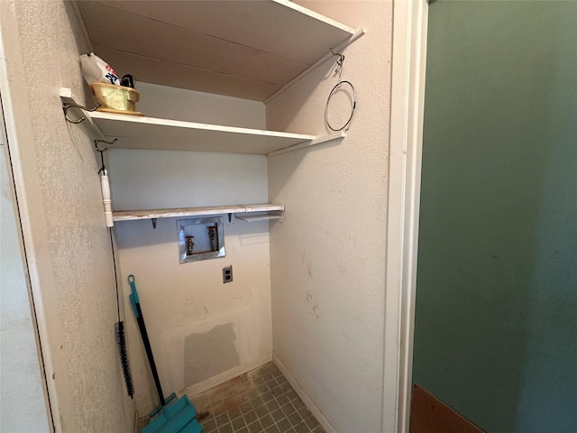 laundry area featuring electric dryer hookup, tile patterned flooring, and washer hookup