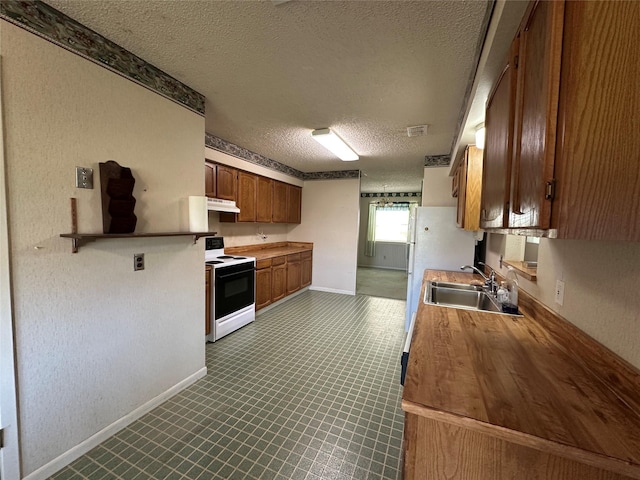 kitchen featuring a textured ceiling, white electric stove, and sink