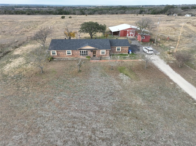 birds eye view of property with a rural view