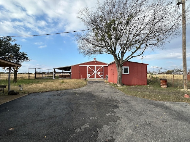 view of outbuilding featuring a carport