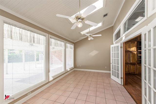 unfurnished sunroom with ceiling fan, lofted ceiling, and french doors