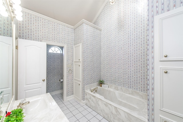 bathroom featuring tile patterned flooring, a bathtub, ornamental molding, and vanity