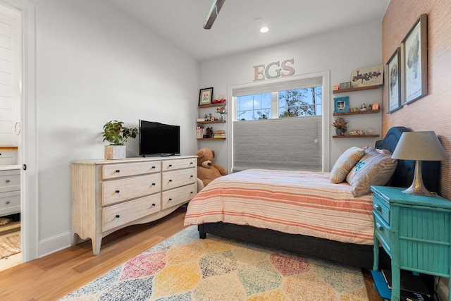 bedroom featuring hardwood / wood-style flooring and ceiling fan