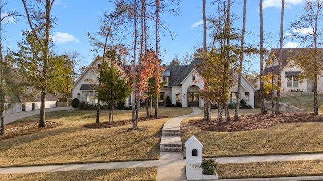 view of front of home with a front yard