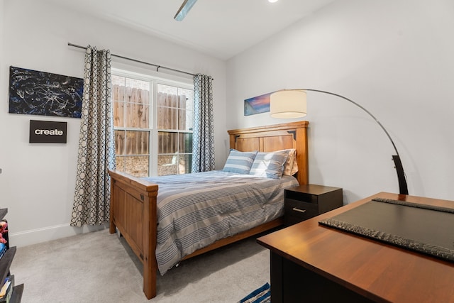 bedroom featuring ceiling fan and light carpet