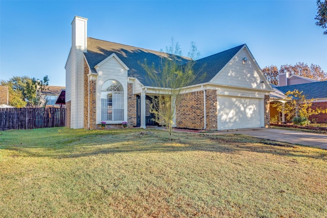 view of front facade with a front lawn and a garage