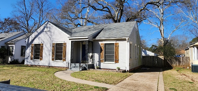 bungalow-style home with a front lawn