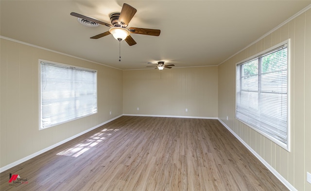 empty room with light hardwood / wood-style floors, ceiling fan, and crown molding