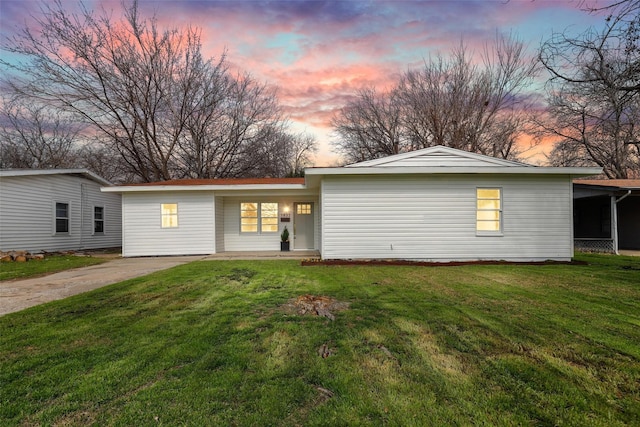 view of front of home with a yard