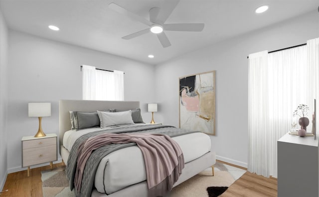 bedroom featuring ceiling fan and light wood-type flooring