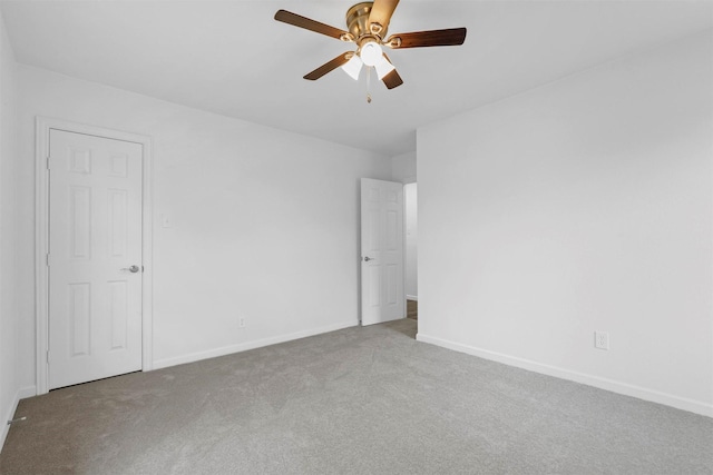 unfurnished bedroom featuring ceiling fan and light colored carpet