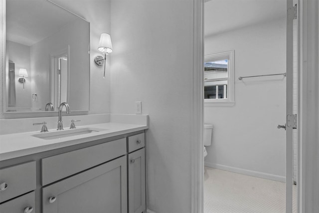 bathroom with vanity and toilet