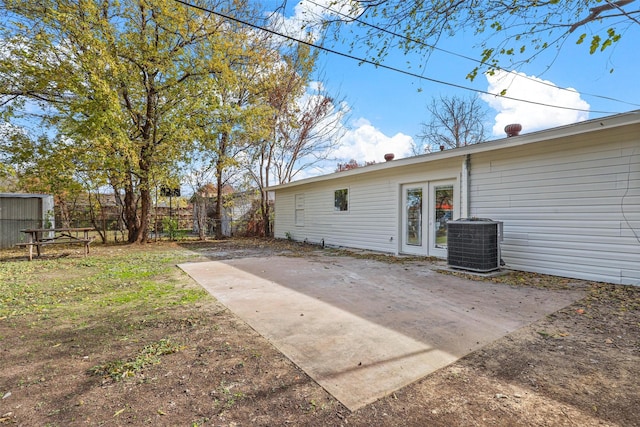 view of yard featuring central AC and a patio