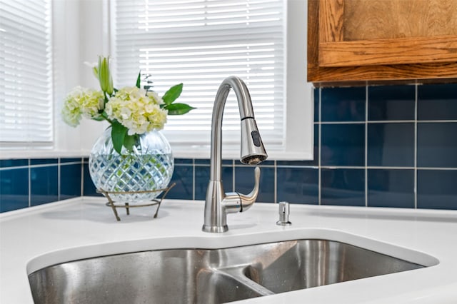 room details with sink and tasteful backsplash