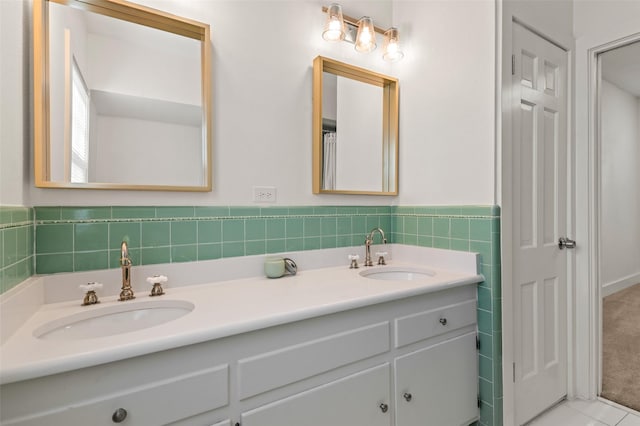 bathroom with tile patterned floors and vanity