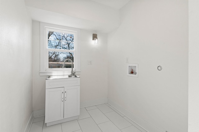 laundry room featuring light tile patterned floors, sink, and hookup for a washing machine