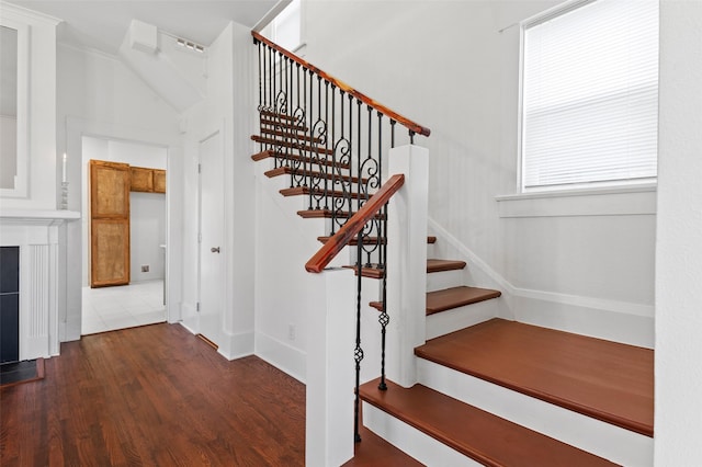 stairway featuring hardwood / wood-style flooring