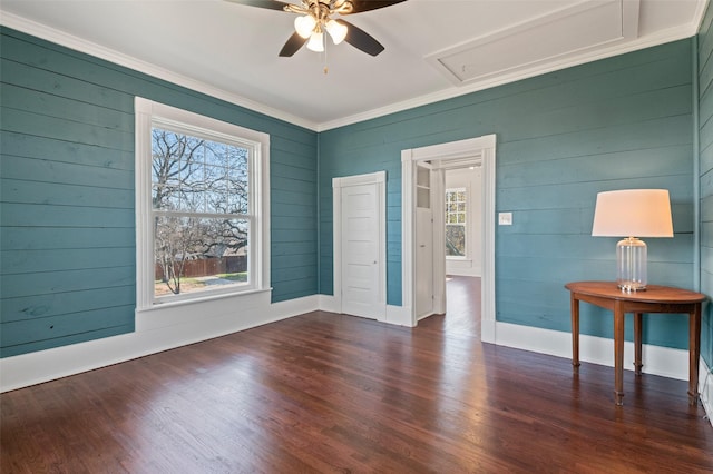 spare room with ceiling fan, dark hardwood / wood-style flooring, and crown molding