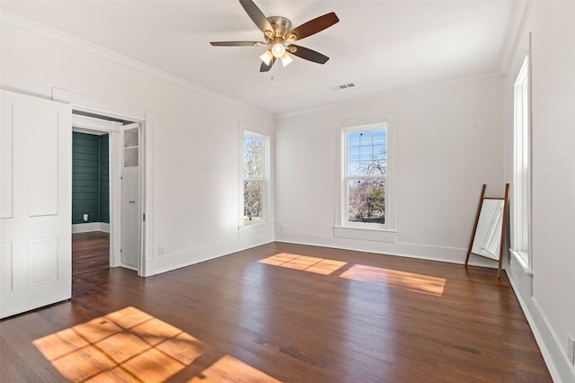 unfurnished room with ceiling fan, dark hardwood / wood-style flooring, and ornamental molding