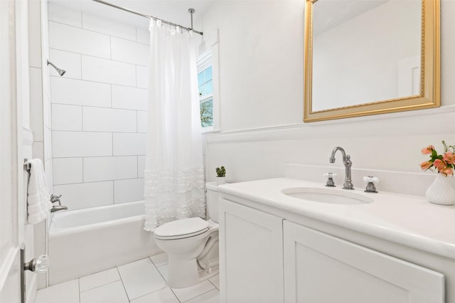 full bathroom with vanity, tile patterned floors, toilet, and shower / bath combo with shower curtain