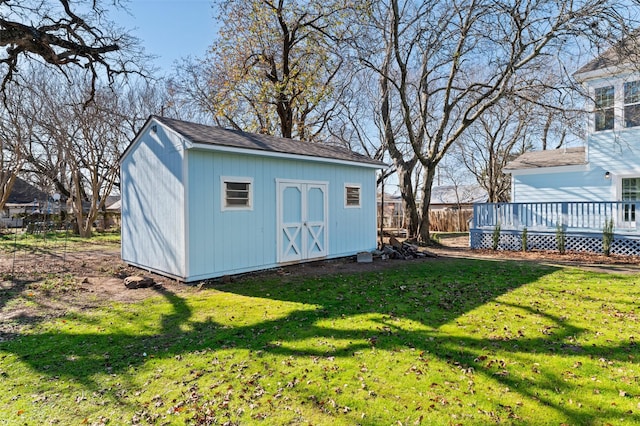 view of outdoor structure featuring a lawn