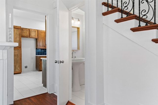 hall featuring light tile patterned flooring