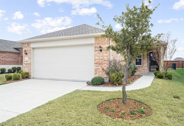 ranch-style home featuring driveway, roof with shingles, a front lawn, and brick siding