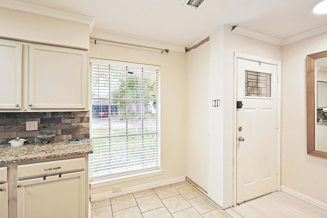 doorway featuring crown molding