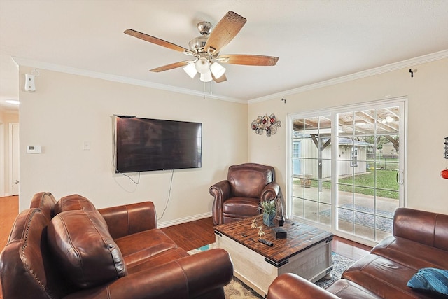 living room featuring hardwood / wood-style flooring, ceiling fan, and crown molding